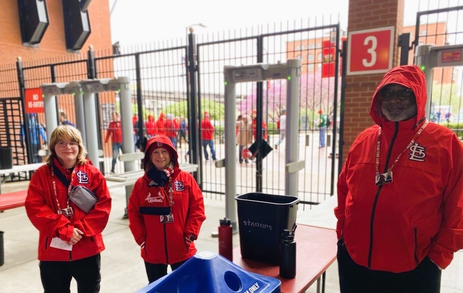 Tyler at work Cardinals game 2024 Three staff members in Cardinals gear working an admission gate at Busch Stadium