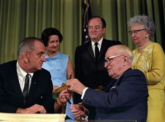 President Johnson handing President Truman the pen he used to sign Medicare into law President Johnson handing President Truman the pen he used to sign Medicare into law.